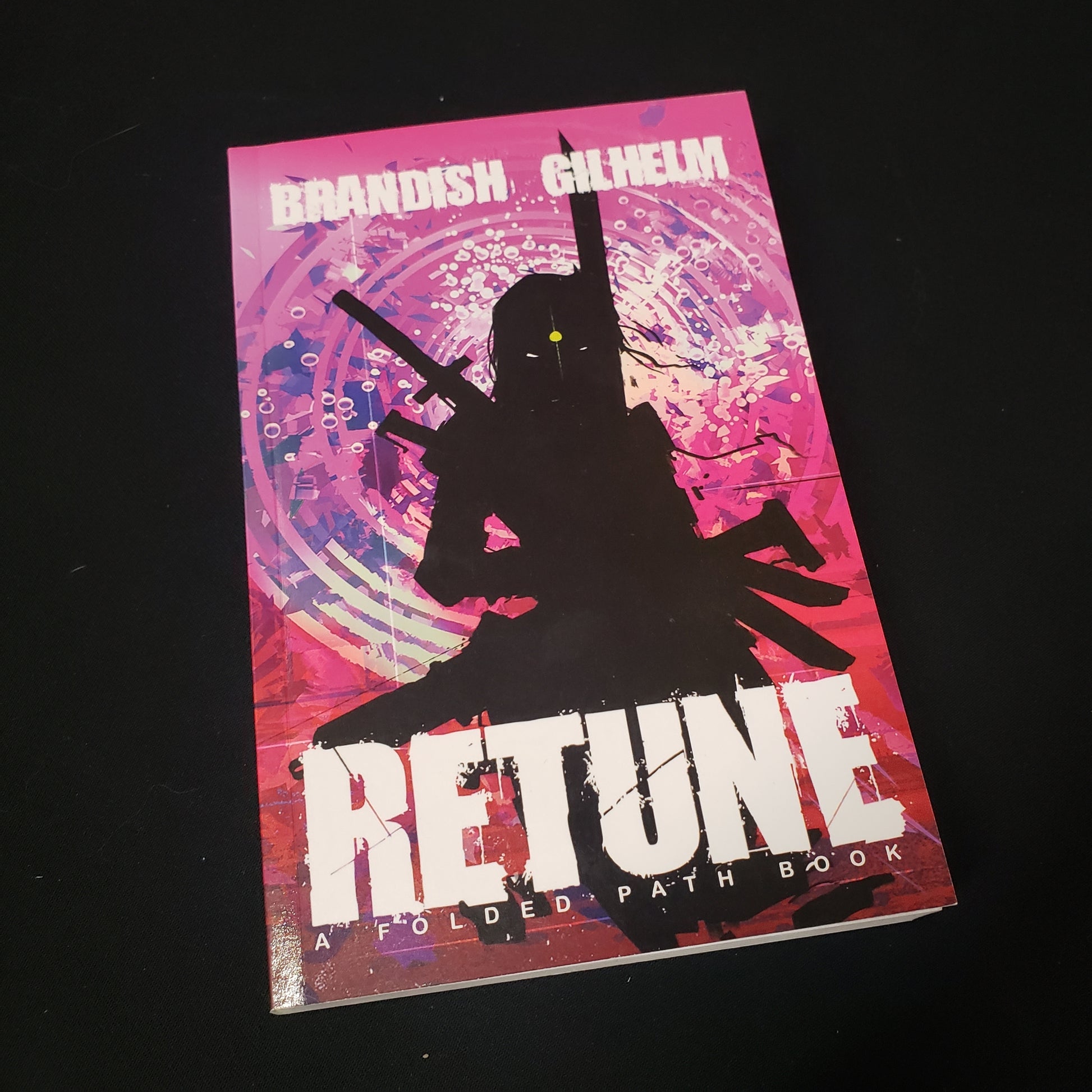 Image shows the front cover of the Retune: Folded Path roleplaying game book