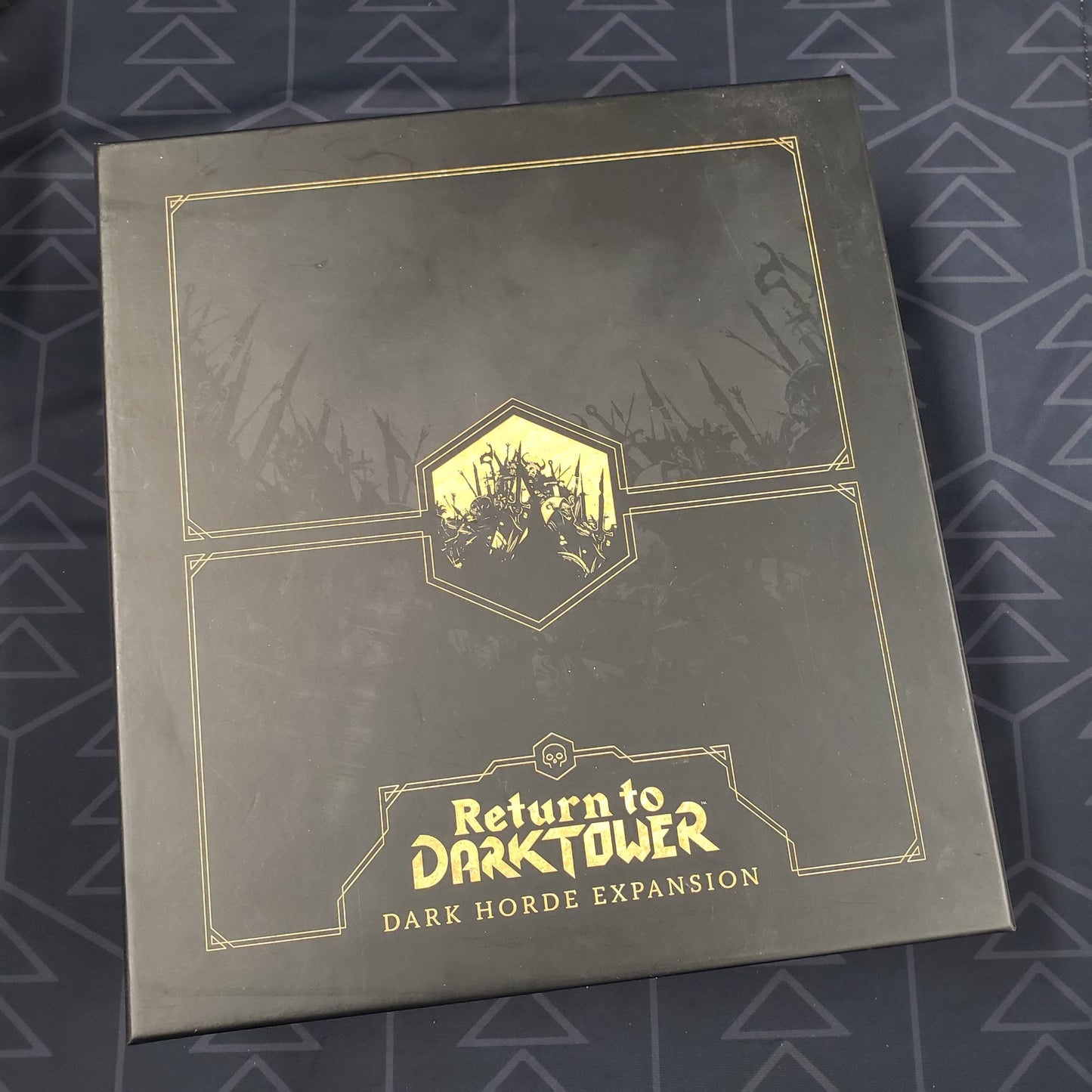 Image shows the front cover of the box of the Dark Horde expansion for the board game Return to Dark Tower