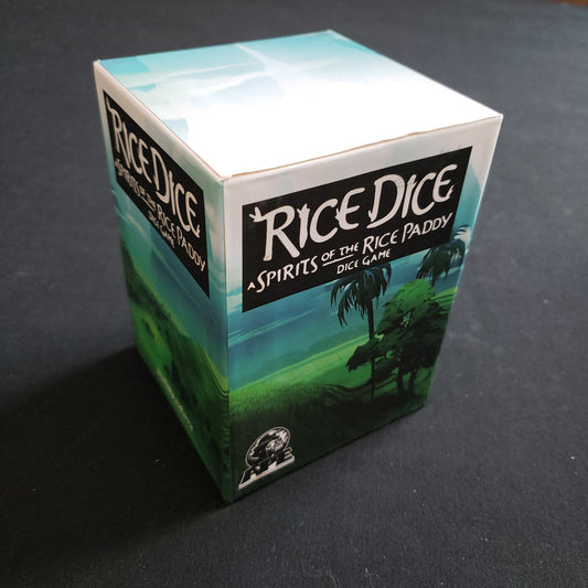 Image shows the front cover of the box of the Rice Dice board game