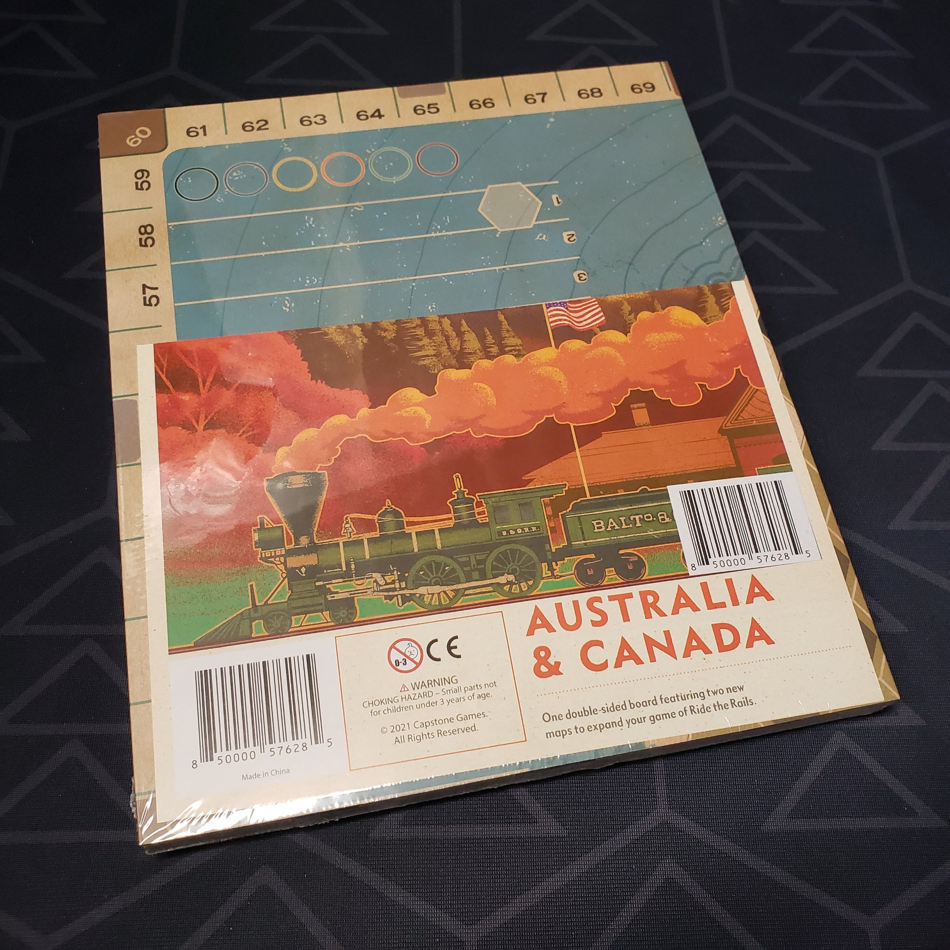 Image shows the front of the package of the Australia & Canada expansion for the board game Ride the Rails