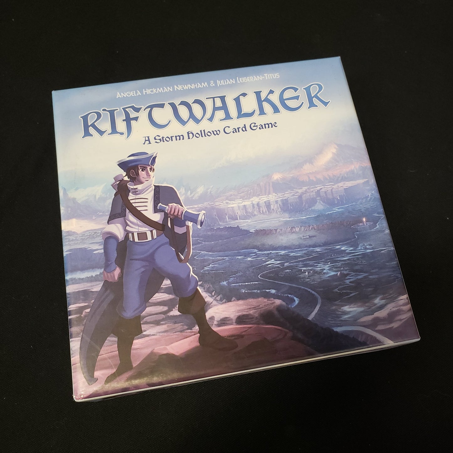 Image shows the front cover of the box of the Riftwalker card game