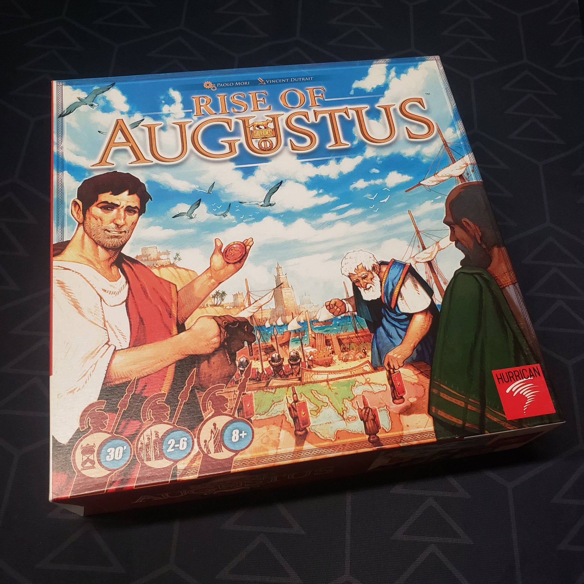 Image shows the front cover of the box of the Rise of Augustus board game