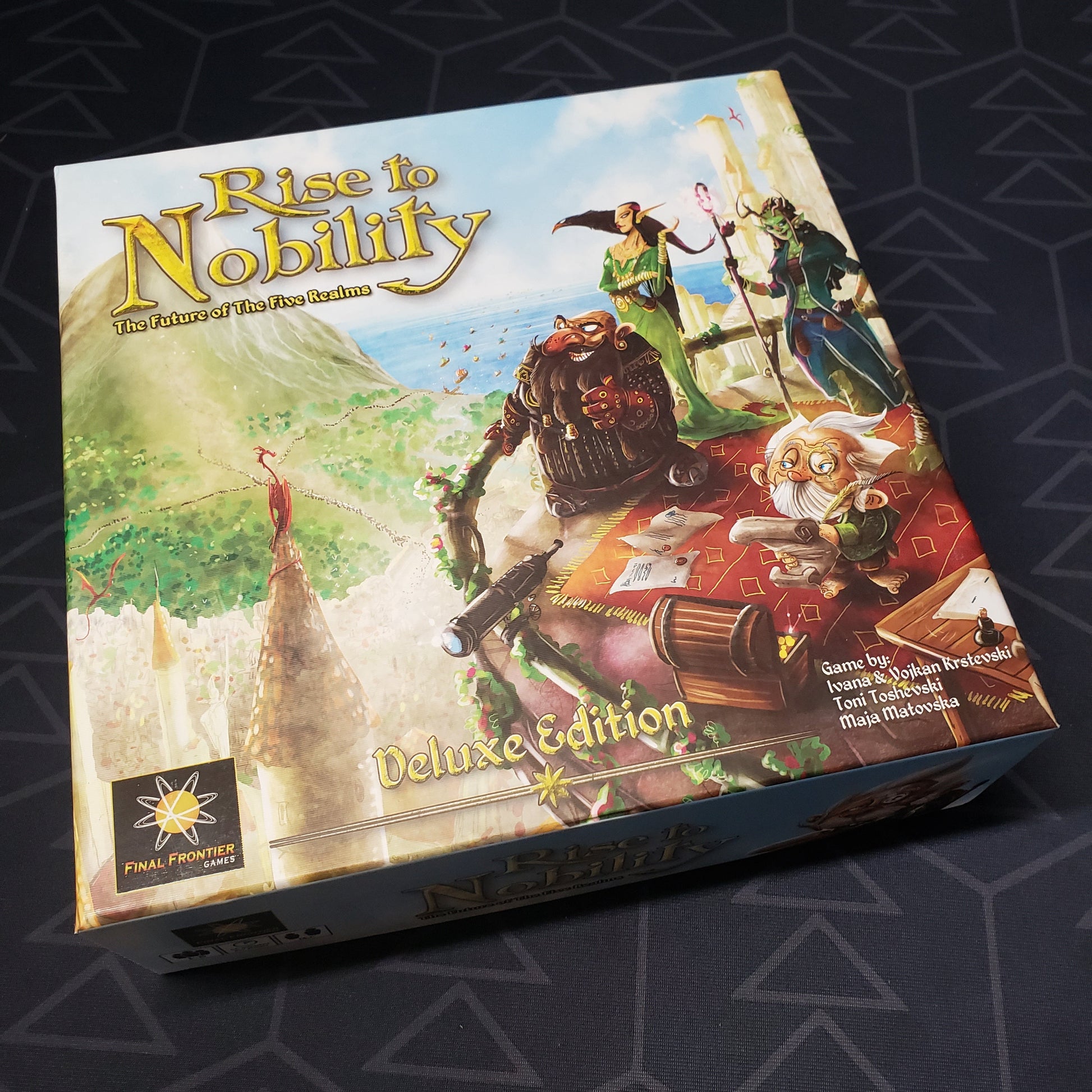 Image shows the front cover of the box of the Deluxe Edition of the board game Rise To Nobility
