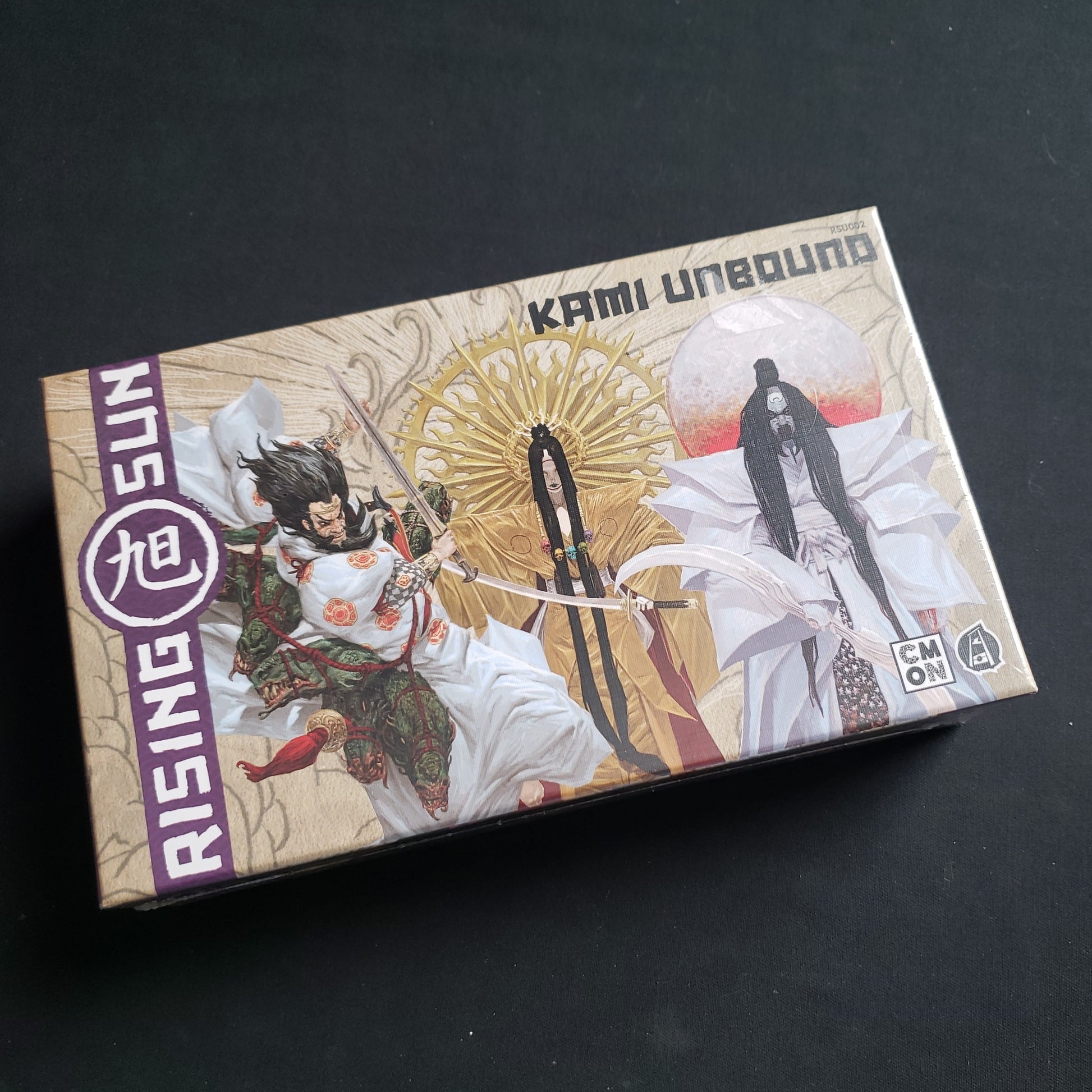 Image shows the front of the box for the Kami Unbound Expansion for the Rising Sun board game