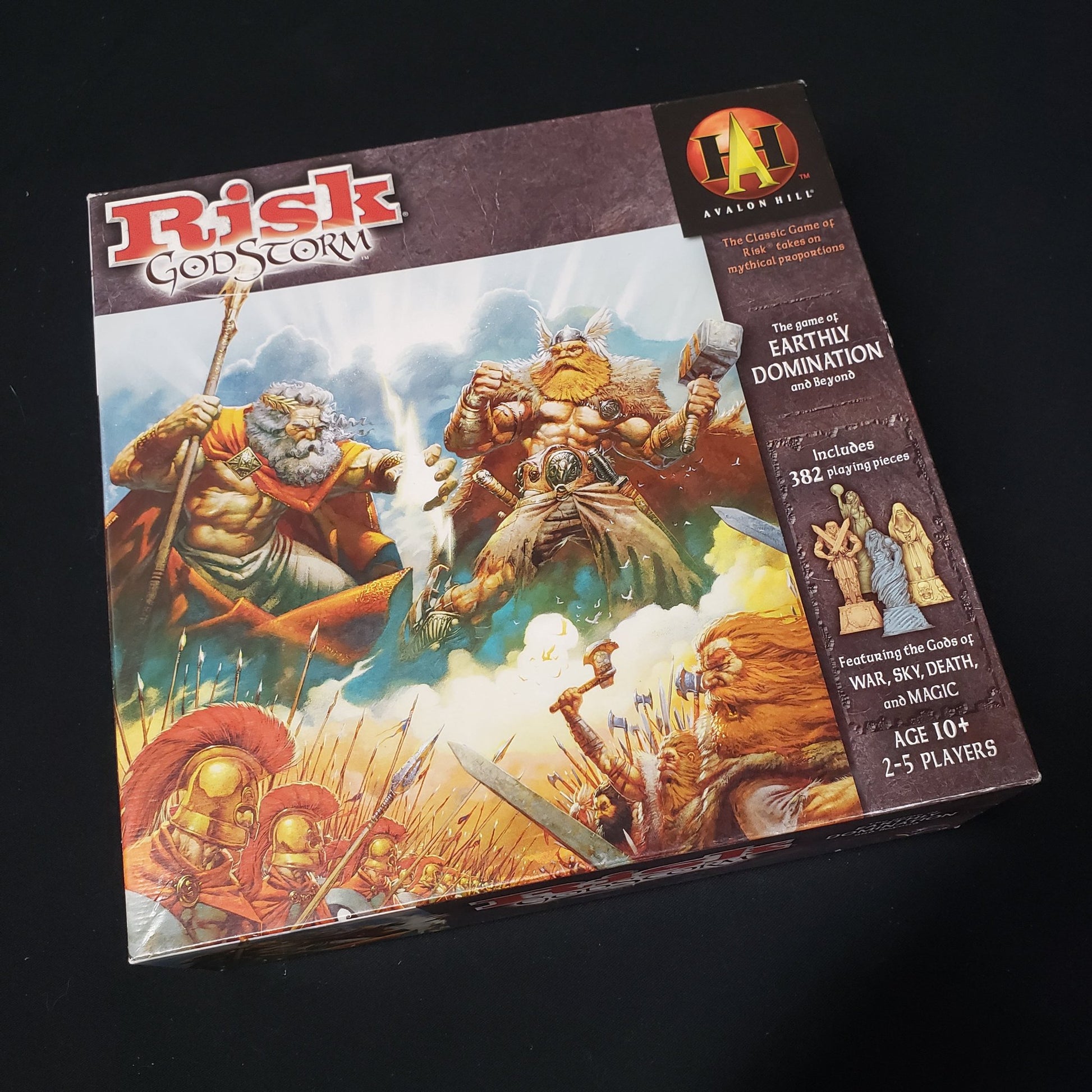Image shows the front cover of the box of the Risk: Godstorm board game