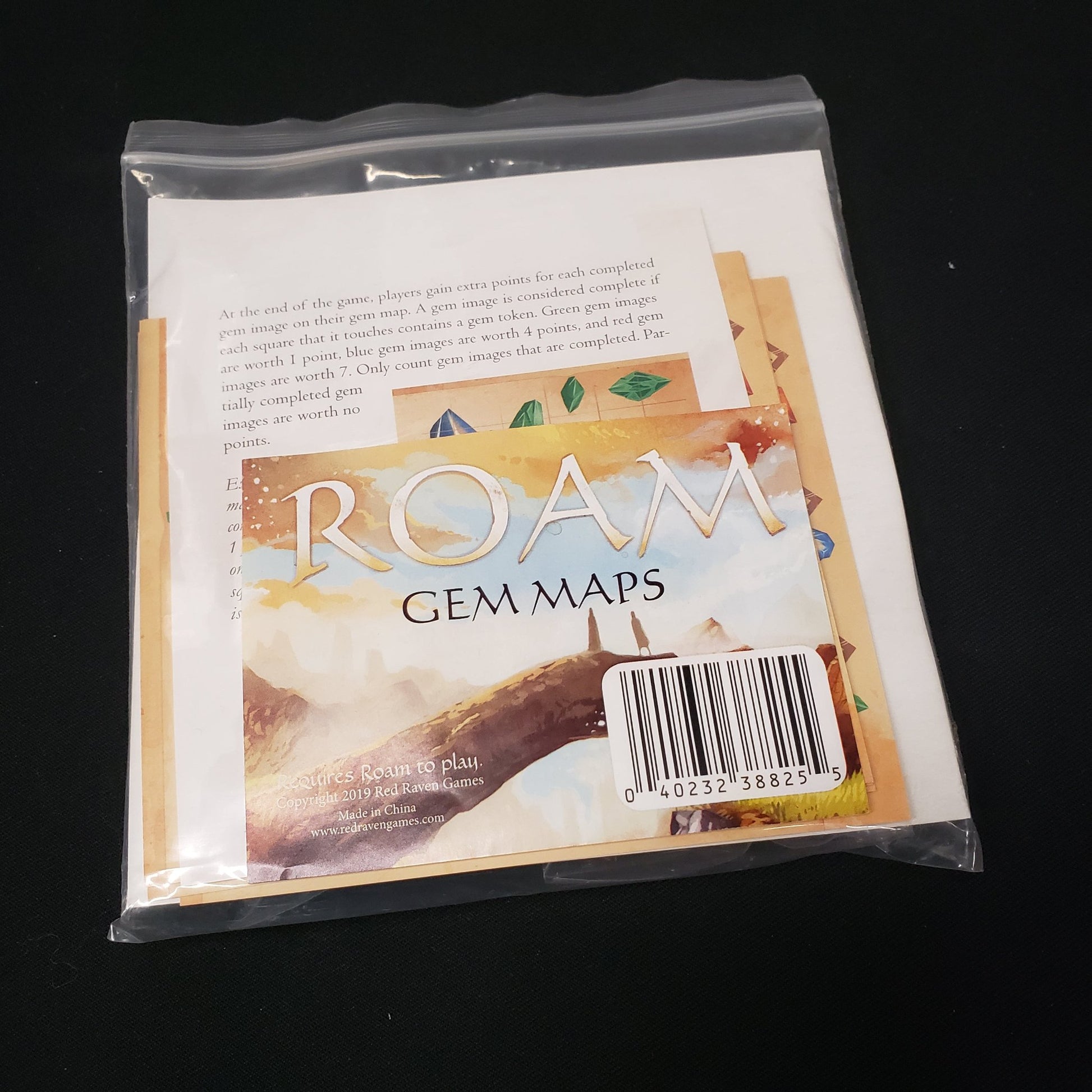 Image shows the front of the package for the Gem Maps expansion for the board game Roam
