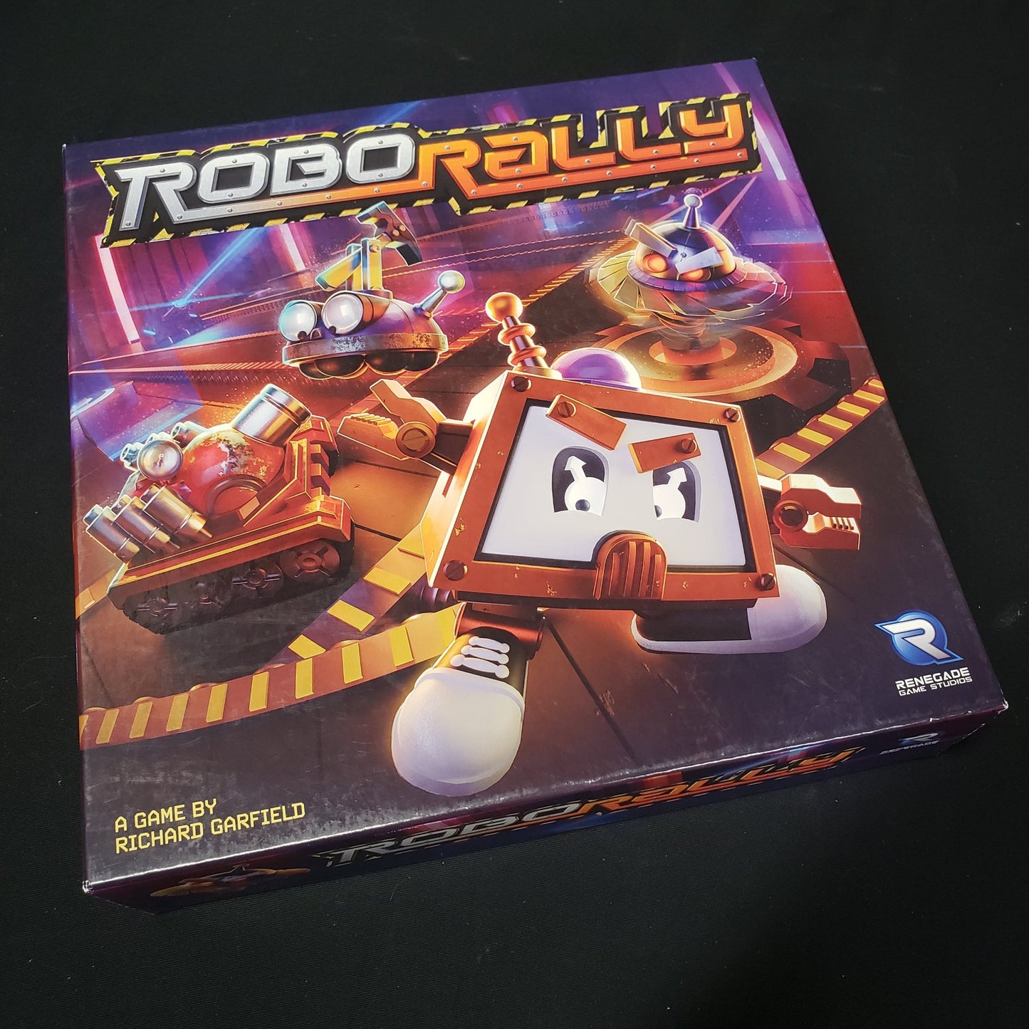 Image shows the front cover of the box of the Robo Rally board game