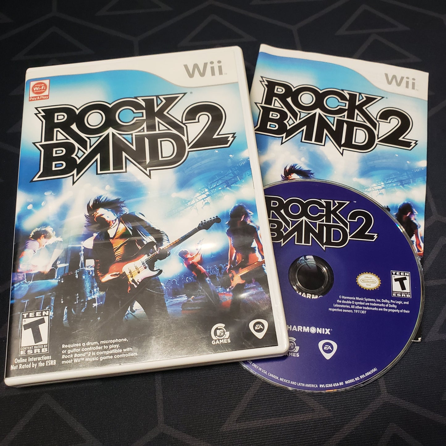 Image shows the case, manual & disc for the video game Rock Band 2 for Nintendo Wii