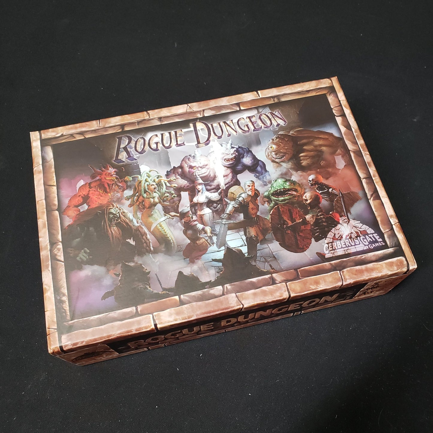 Image shows the front cover of the box of the Rogue Dungeon board game