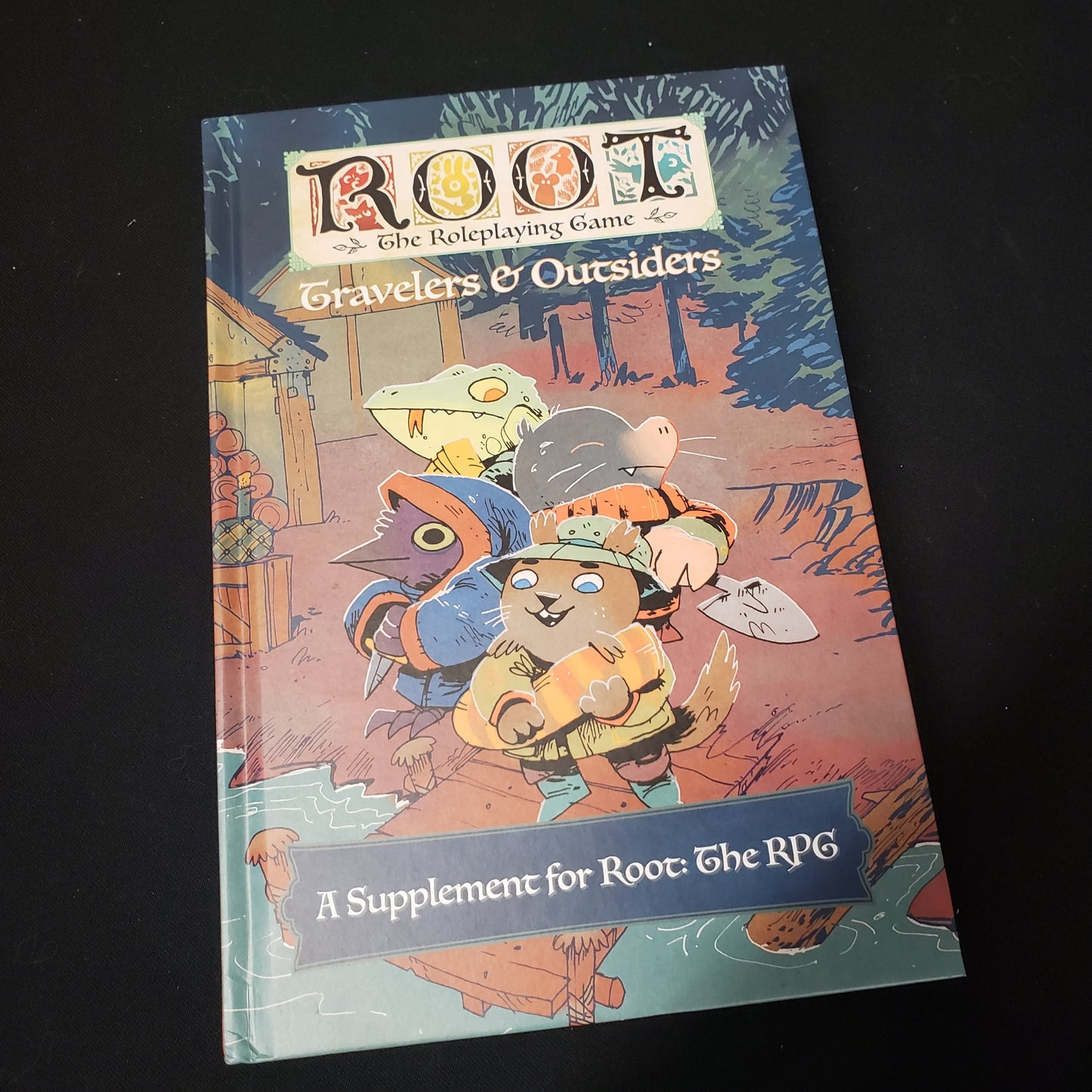 Image shows the front cover of the Travelers & Outsiders book for the Root roleplaying game