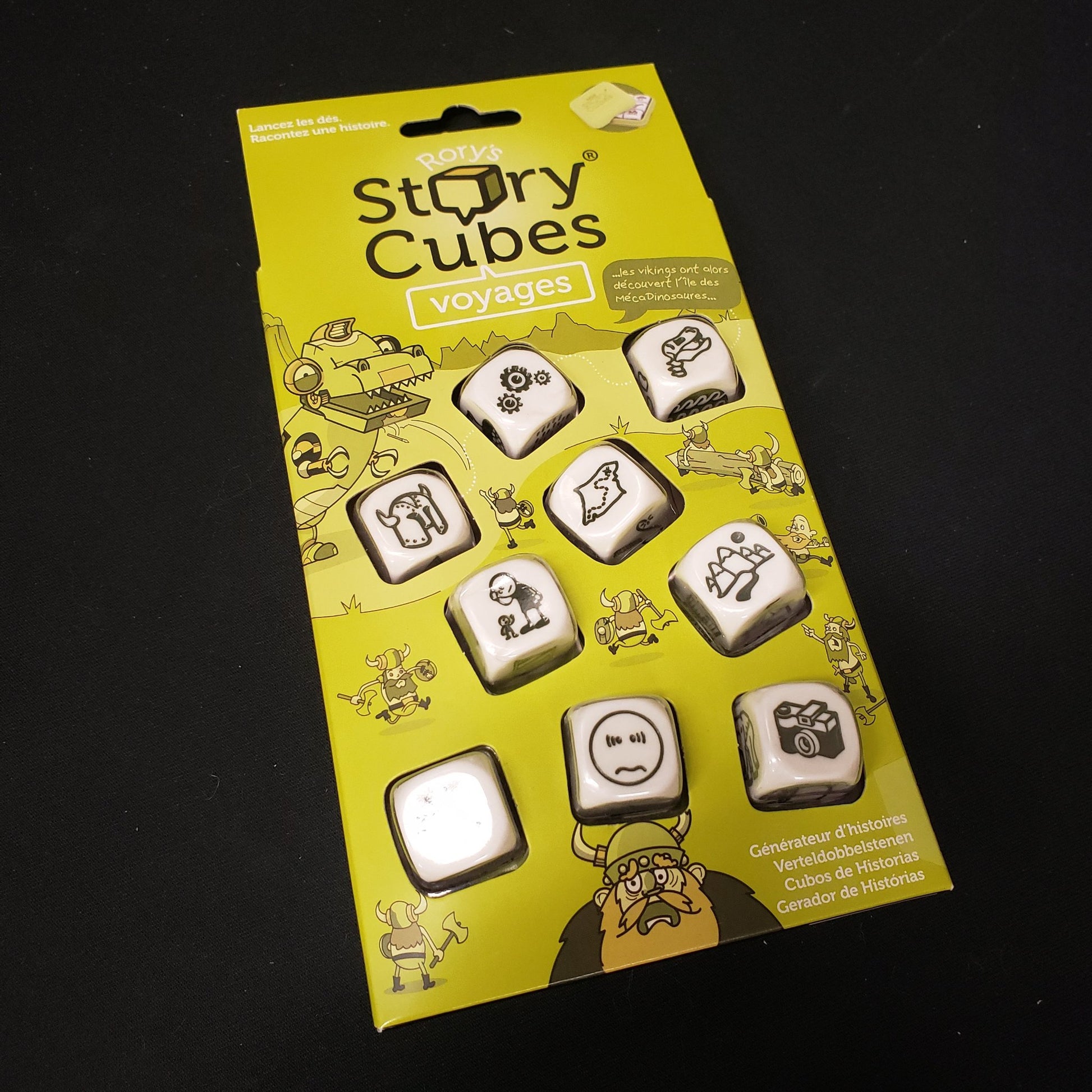 Image shows the front cover of the box of the Rory's Story Cubes: Voyages dice game