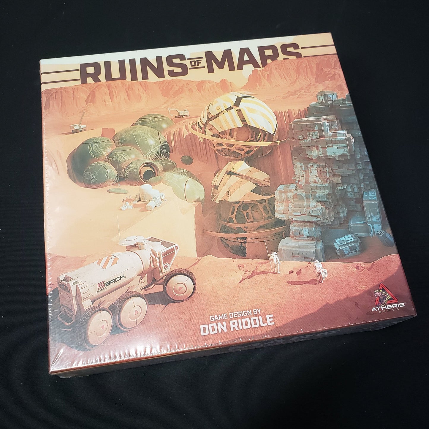 Image shows the front cover of the box of the Ruins of Mars board game