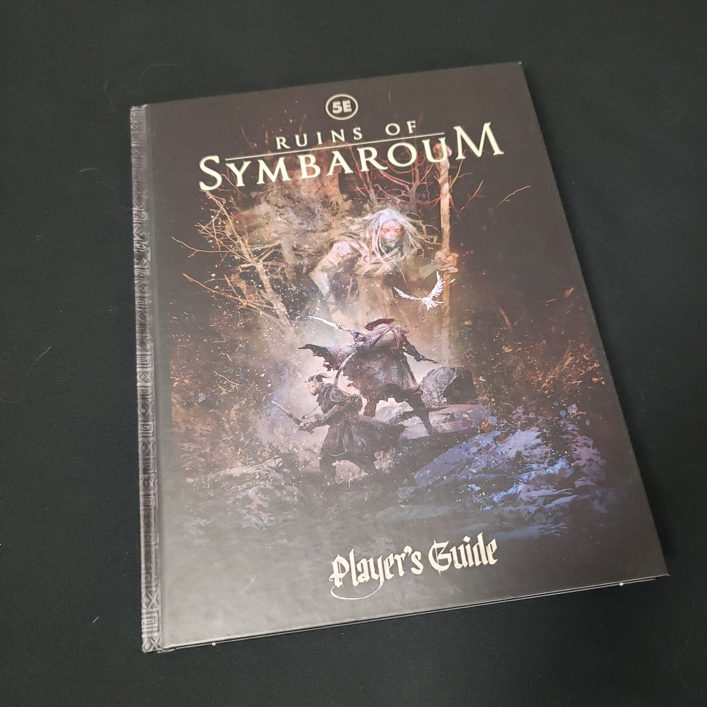 Image shows the front cover of the Player's Guide book for the Ruins of Symbaroum roleplaying game