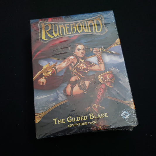 Image shows the front cover of the box of the Gilded Blade Adventure Pack expansion for the board game Runebound