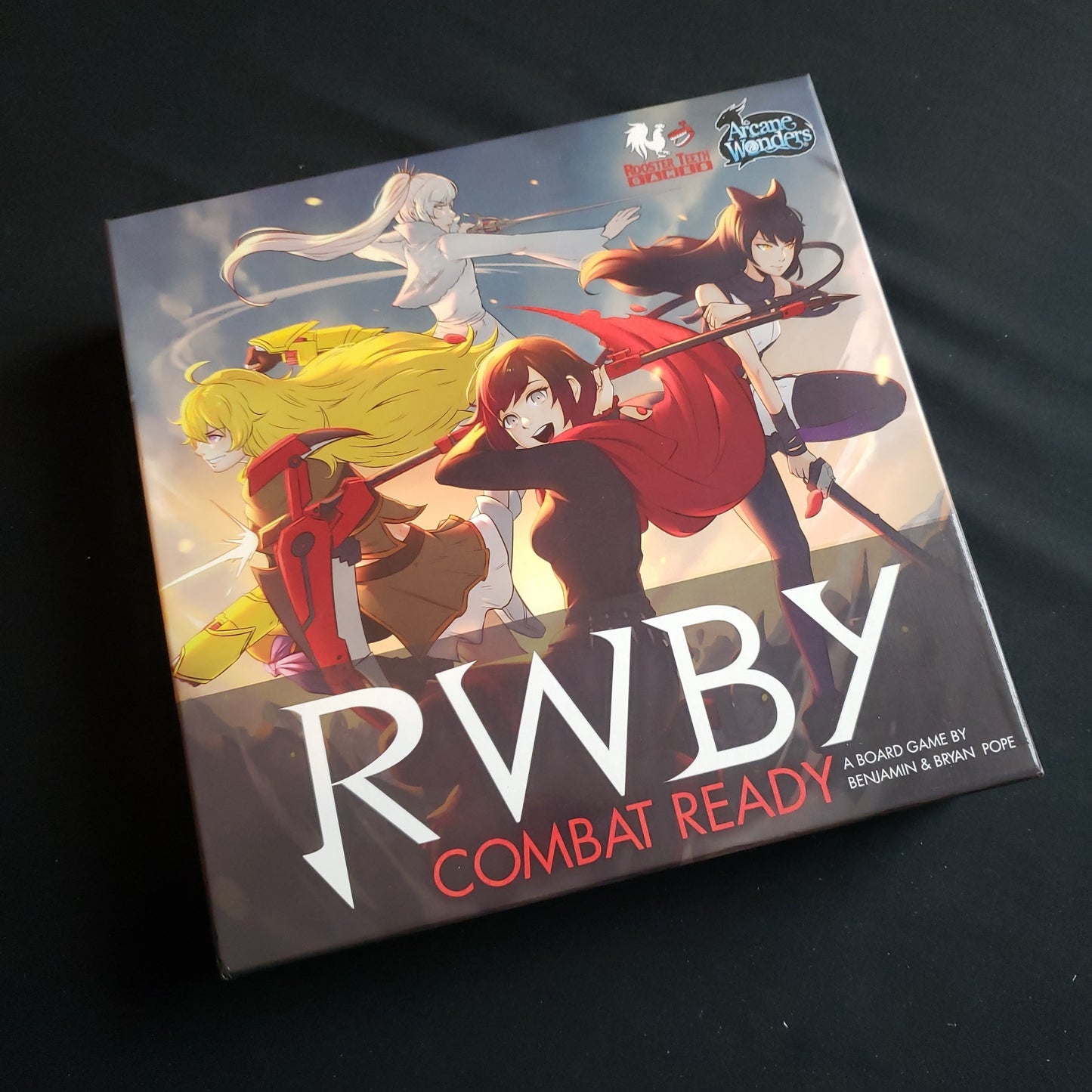 Image shows the front cover of the box of the RWBY: Combat Ready board game