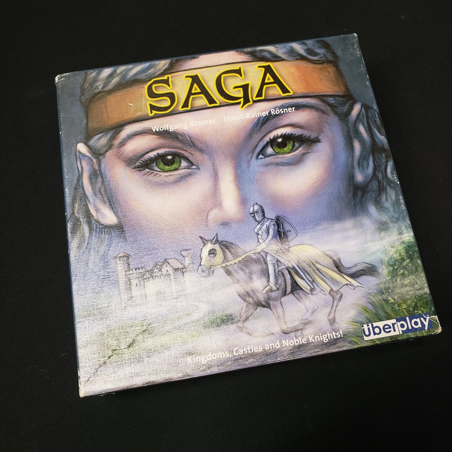 Image shows the front cover of the box of the Saga card game