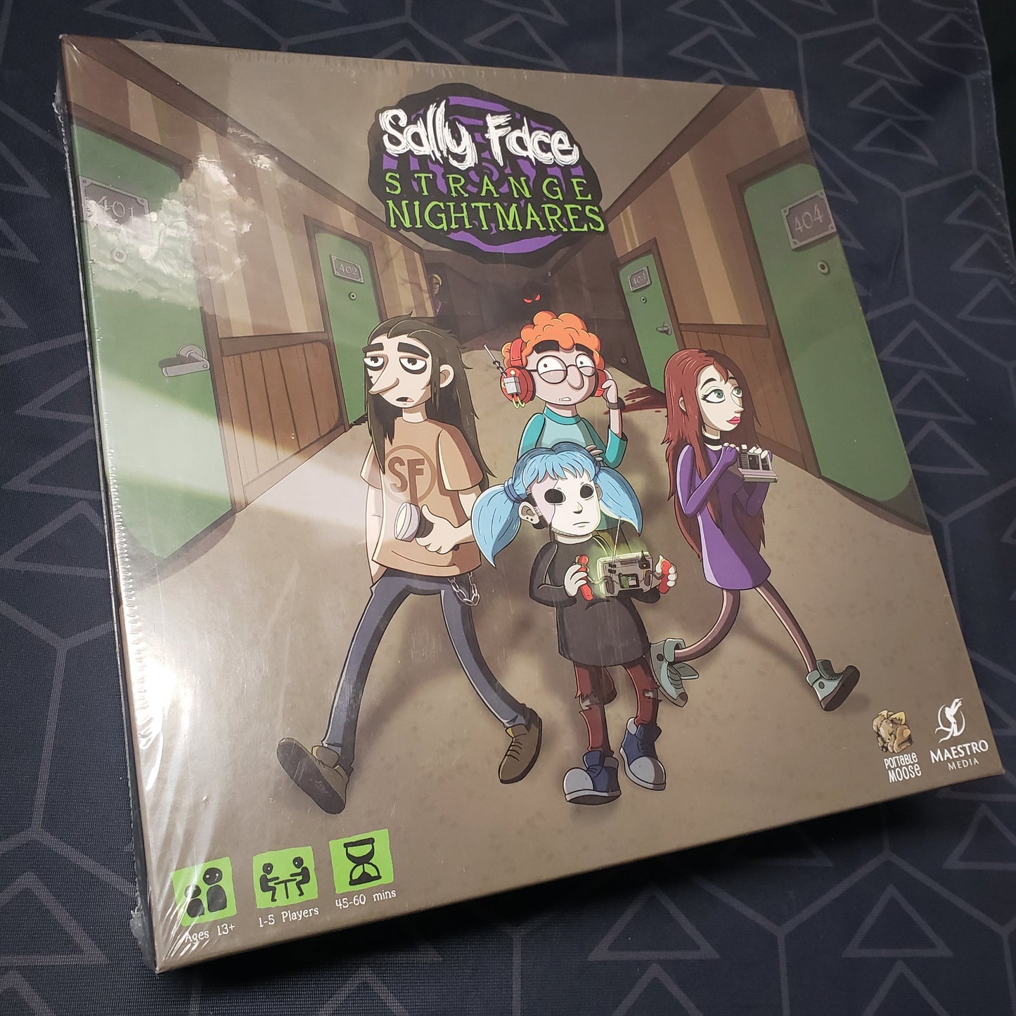 Image shows the front cover of the box for the Sally Face: Strange Nightmares board game