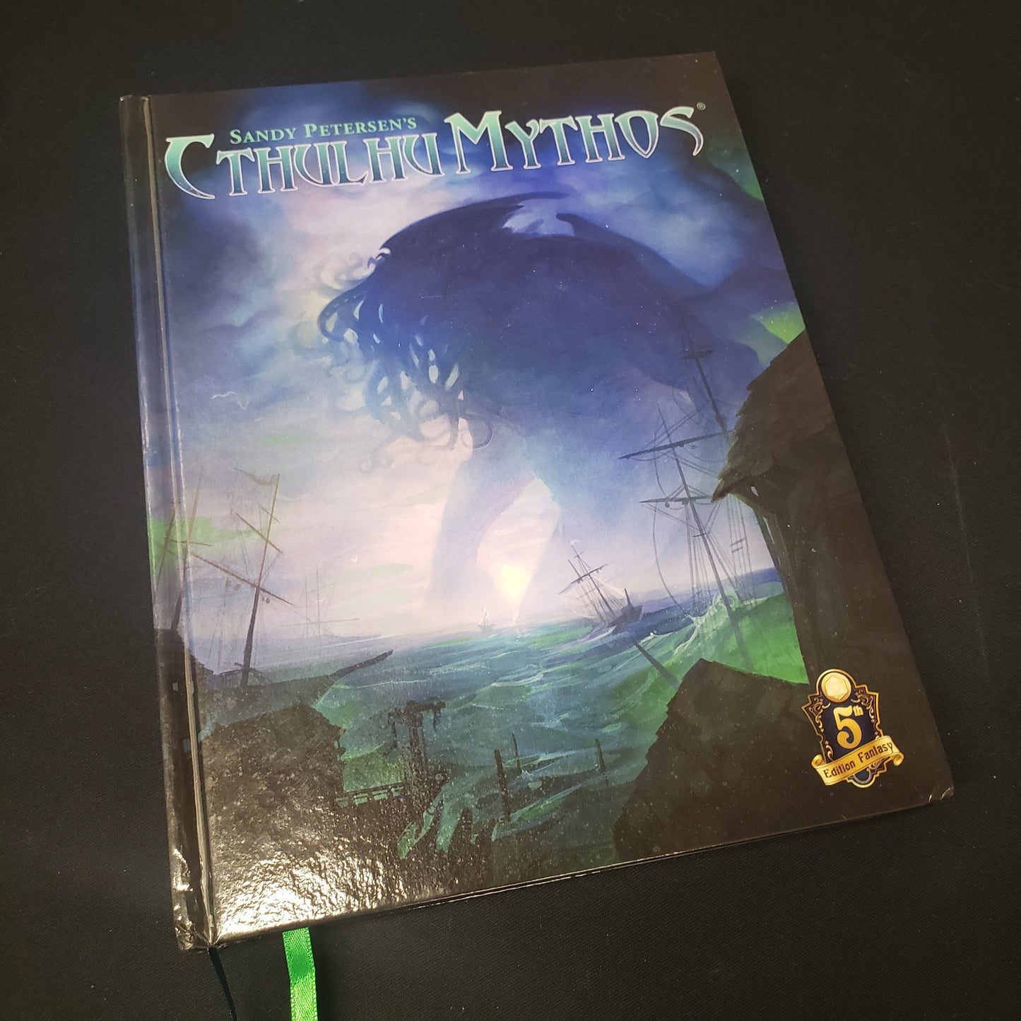Image shows the front cover of the Sandy Petersen's Cthulhu Mythos 5E roleplaying game book