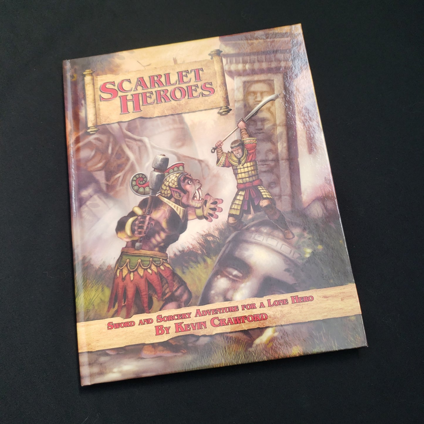 Image shows the front cover of the Scarlet Heroes roleplaying game book