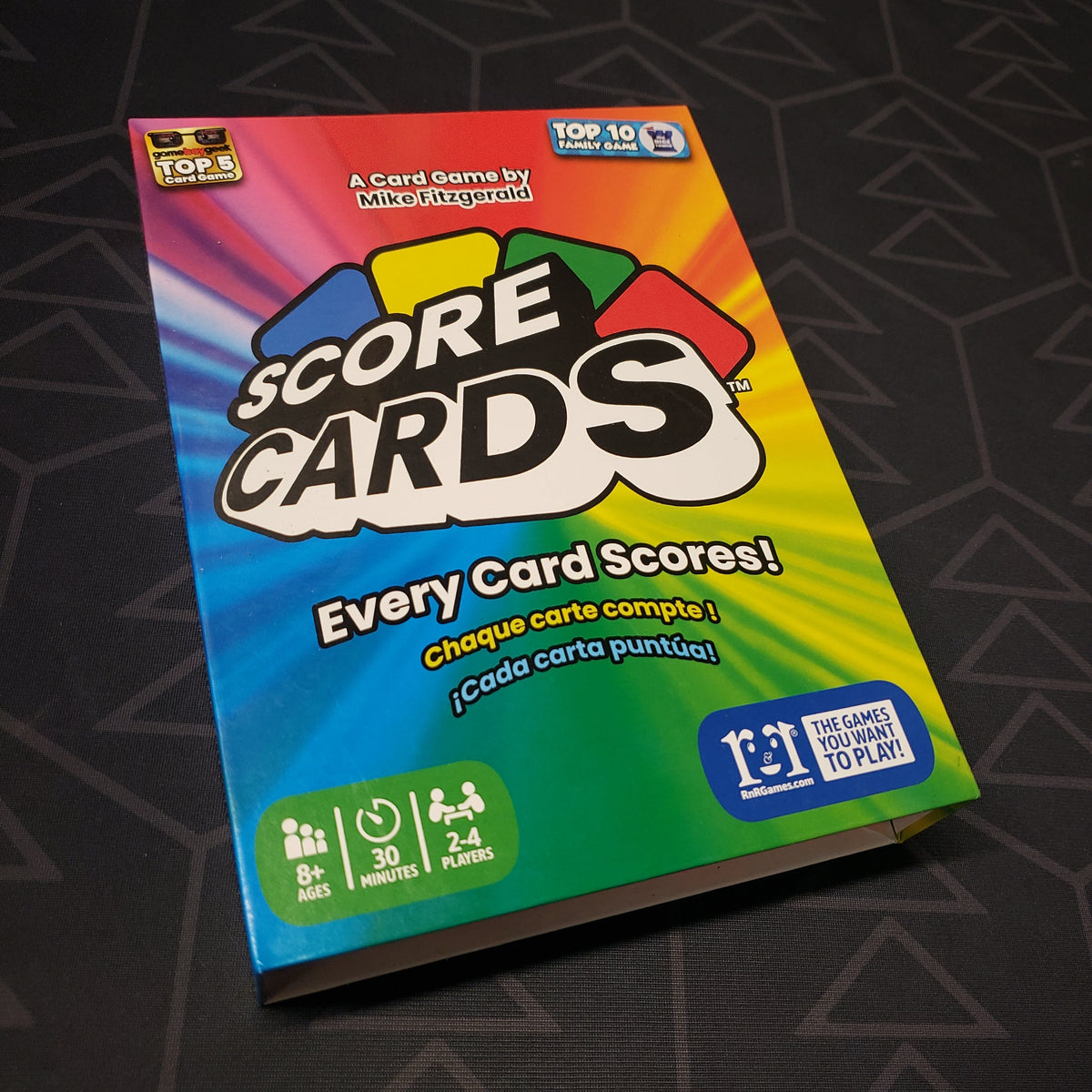 Image shows the front cover of the box for the Score Cards card game