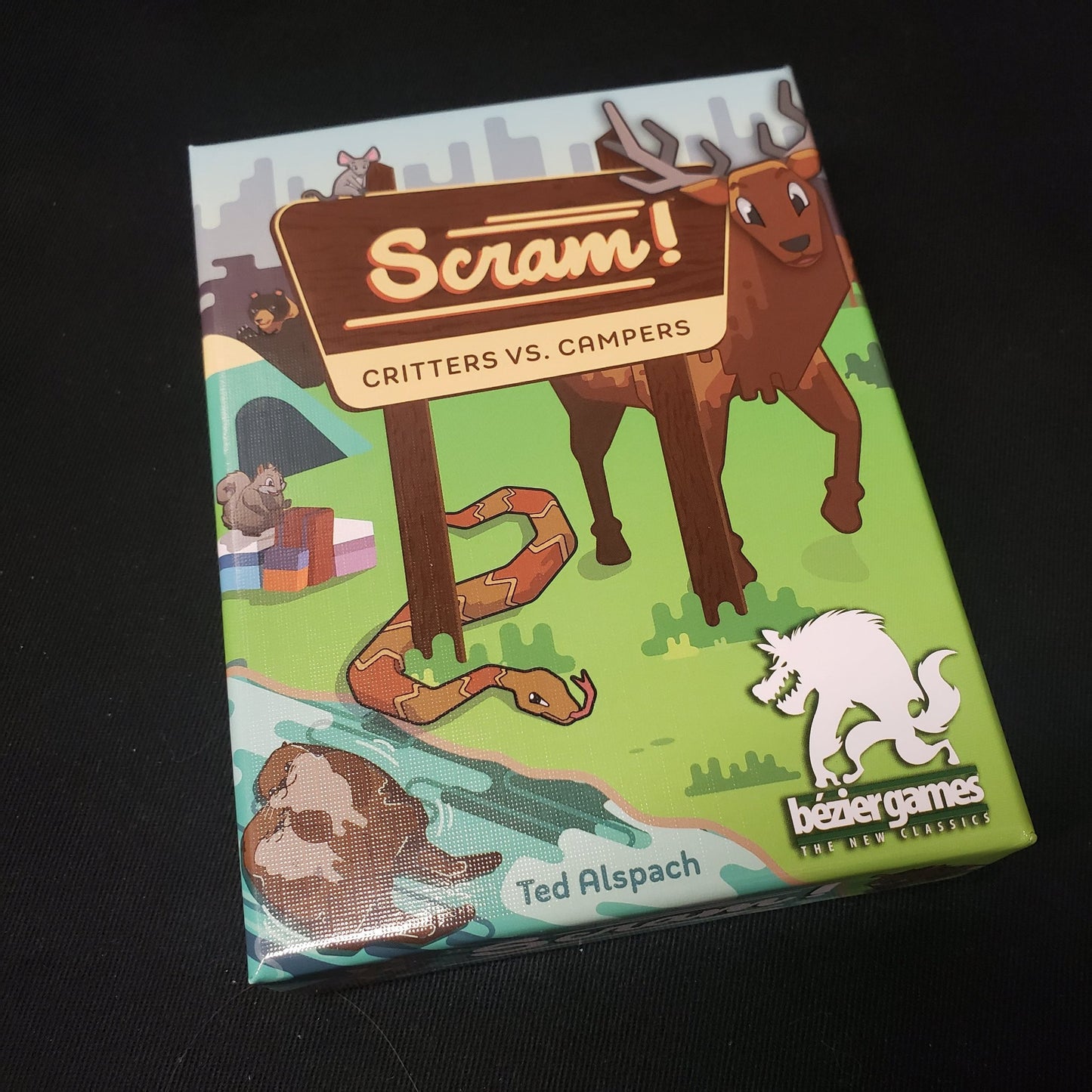 Image shows the front cover of the box of the Scram! card game