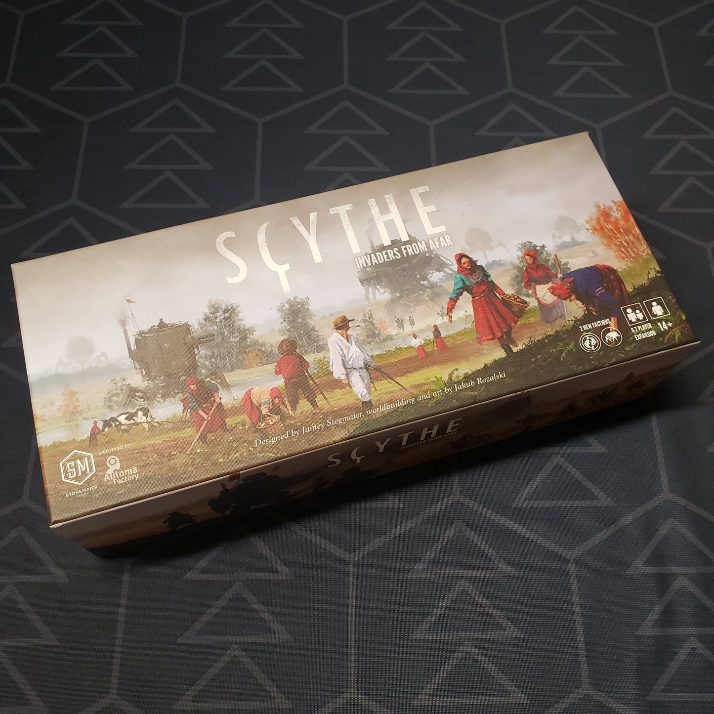 Image shows the front cover of the box of the Invaders from Afar expansion for the board game Scythe