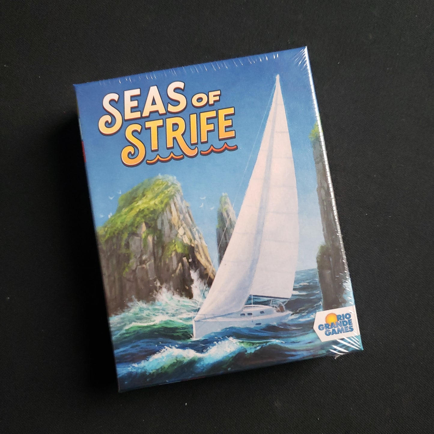 Image shows the front cover of the box of the Seas of Strife card game