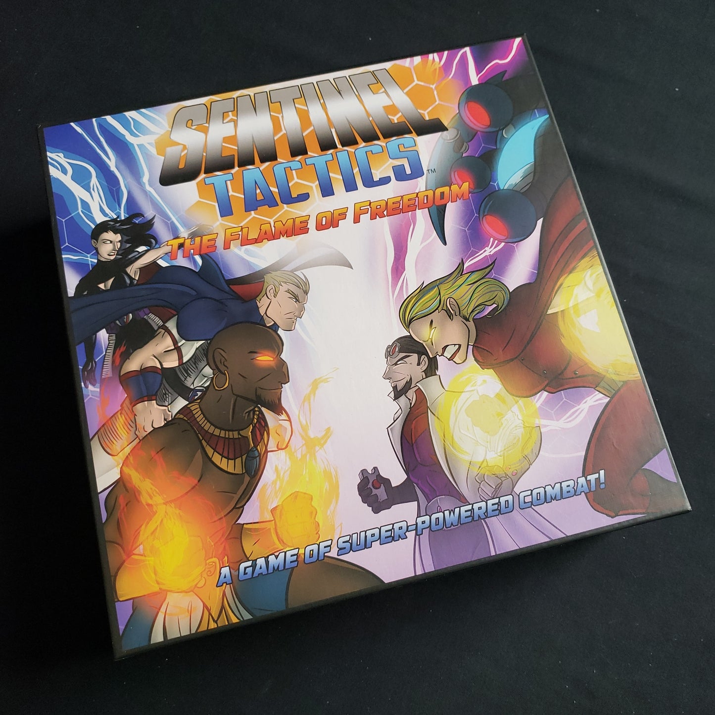 Image shows the front cover of the box of the Sentinel Tactics: The Flame of Freedom board game
