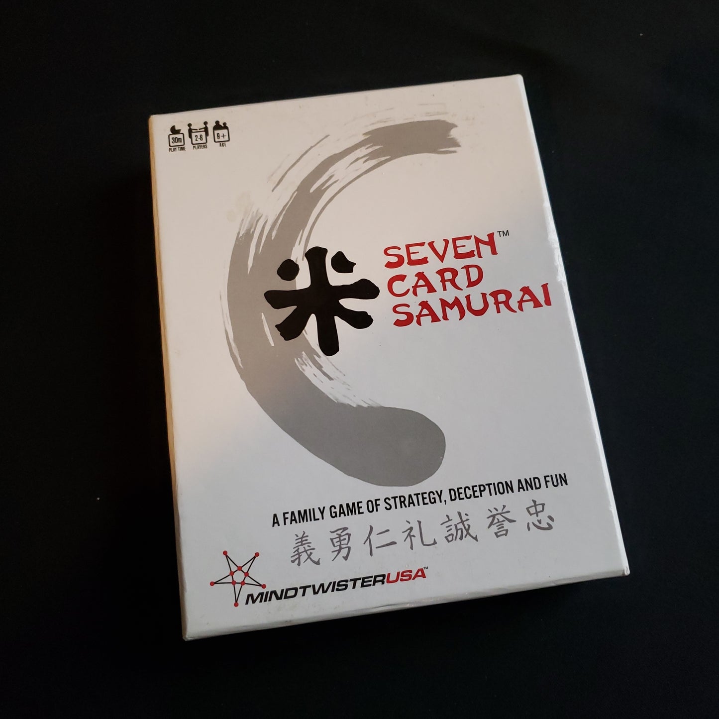 Image shows the front cover of the box of the Seven Card Samurai card game