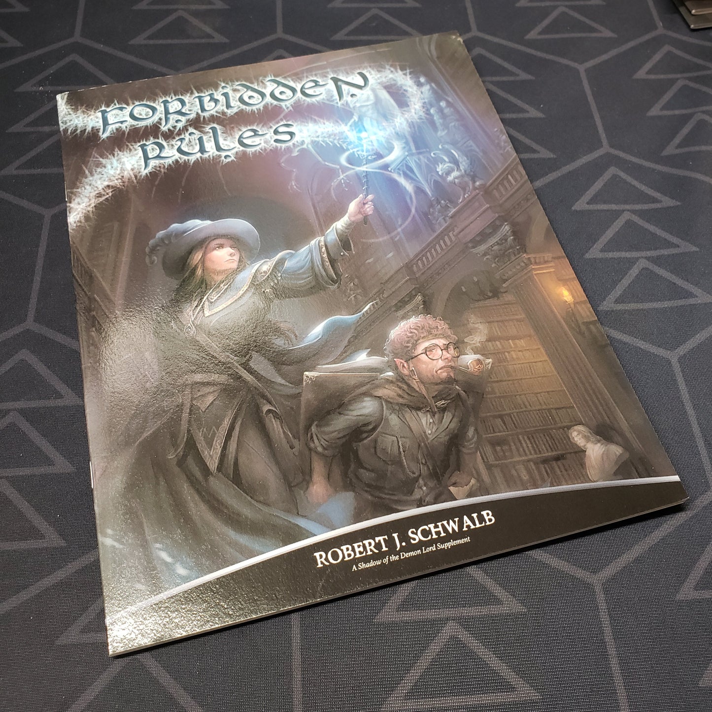 Image shows the front cover of the Forbidden Rules book for the roleplaying game Shadow of the Demon Lord