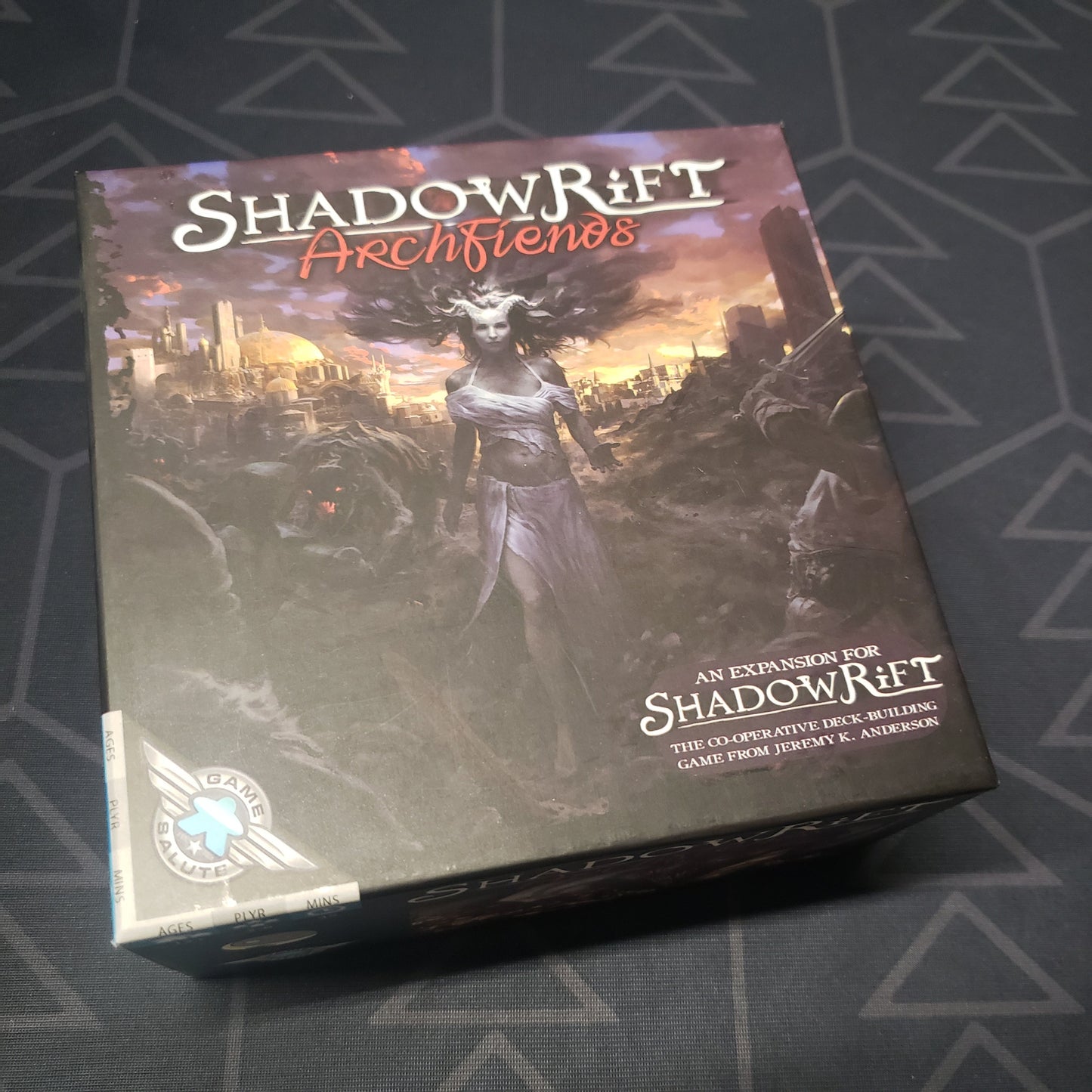 Image shows the front cover of the box of the Archfiends expansion for the card game Shadowrift