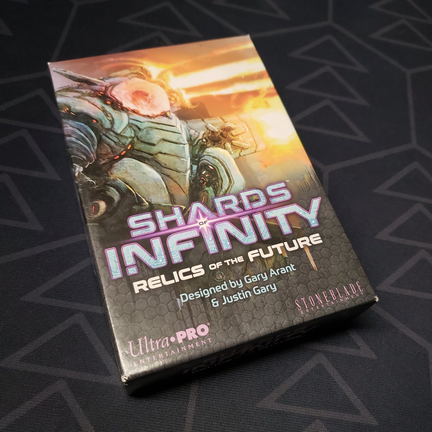 Image shows the front of the box for the Relics of the Future expansion for the card game Shards of Infinity