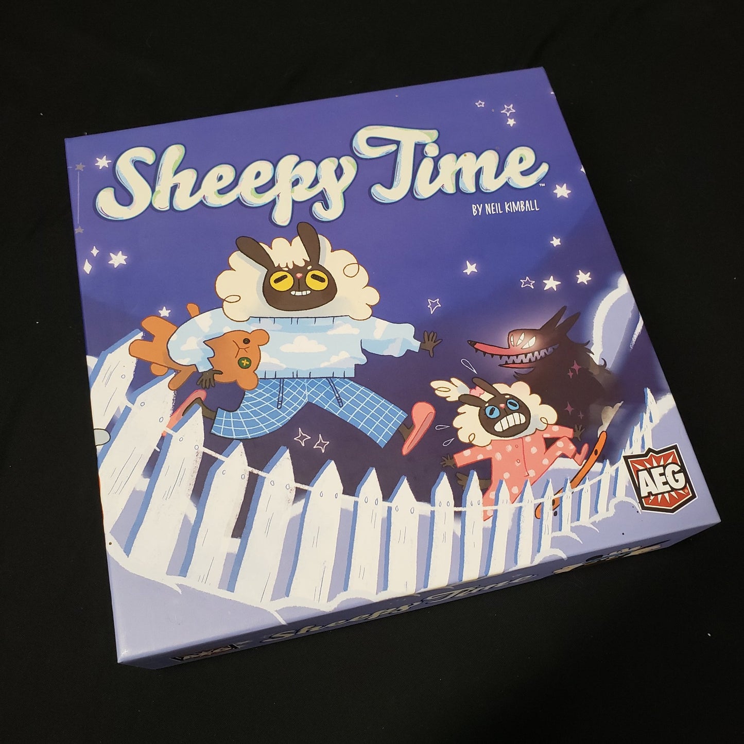 Image shows the front cover of the box of the Sheepy Time board game