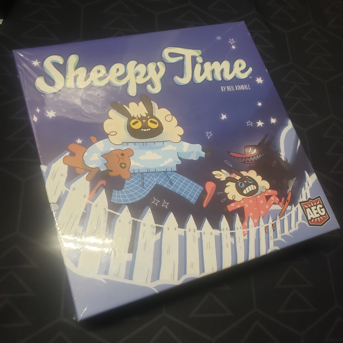 Image shows the front cover of the box of the Sheepy Time board game