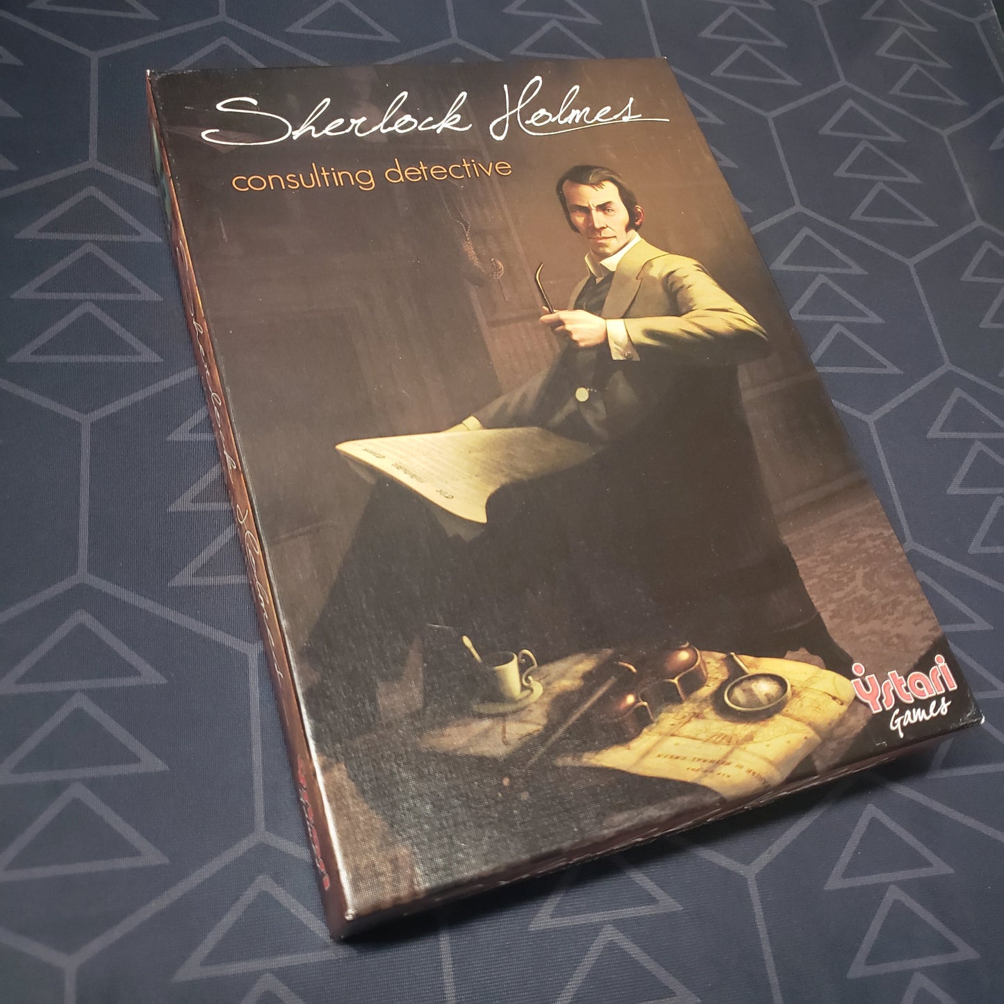 Image shows the front cover of the box of the game Sherlock Holmes Consulting Detective: The Thames Murders and Other Cases