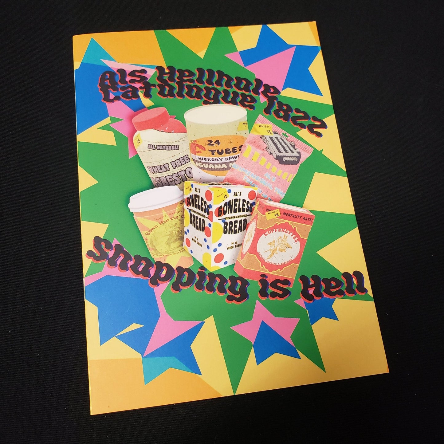 Image shows the front cover of the Shopping is Hell roleplaying game zine