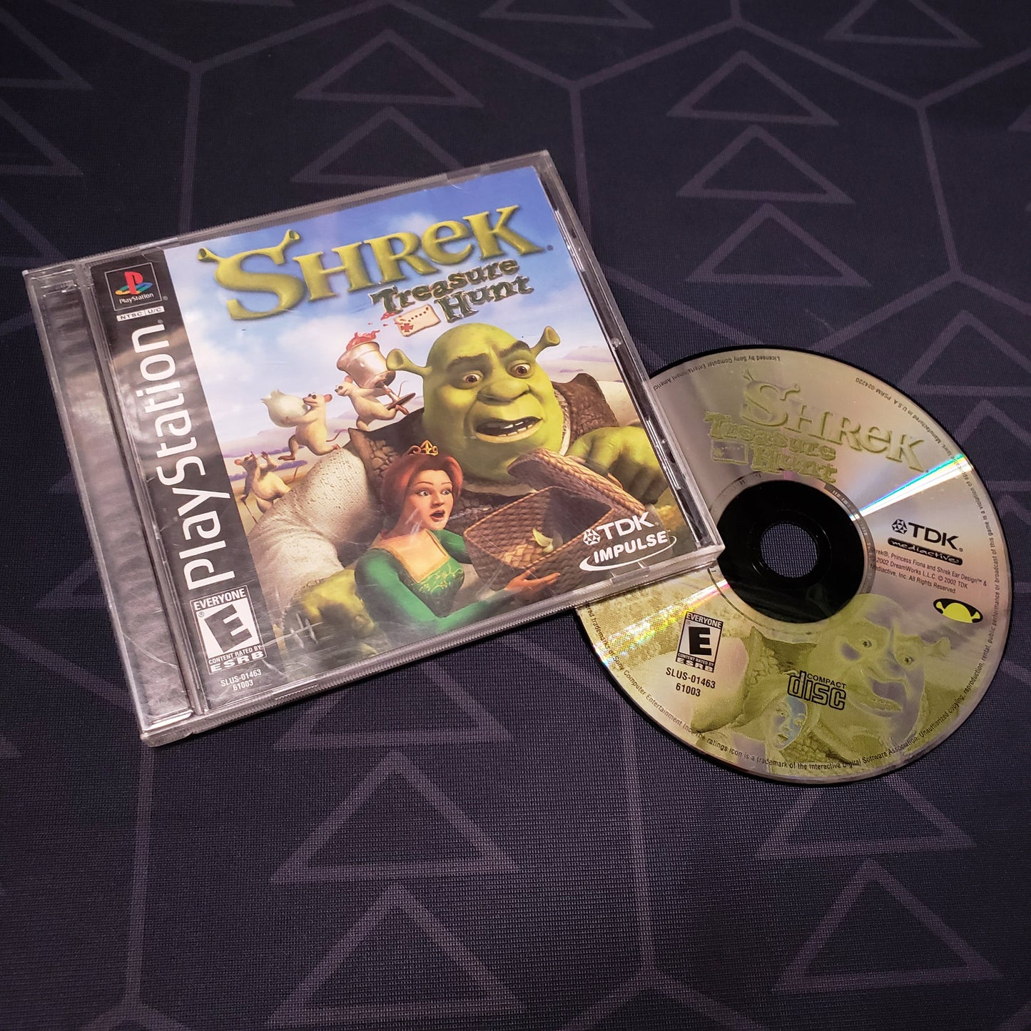 Image shows the jewel case with manual and disc for the video game Shrek Treasure Hunt for Playstation 1