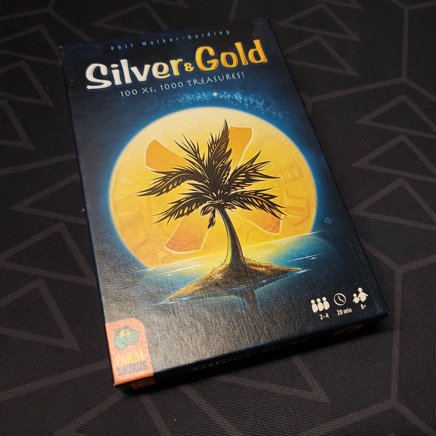 Image shows the front cover of the box of the Silver and Gold game