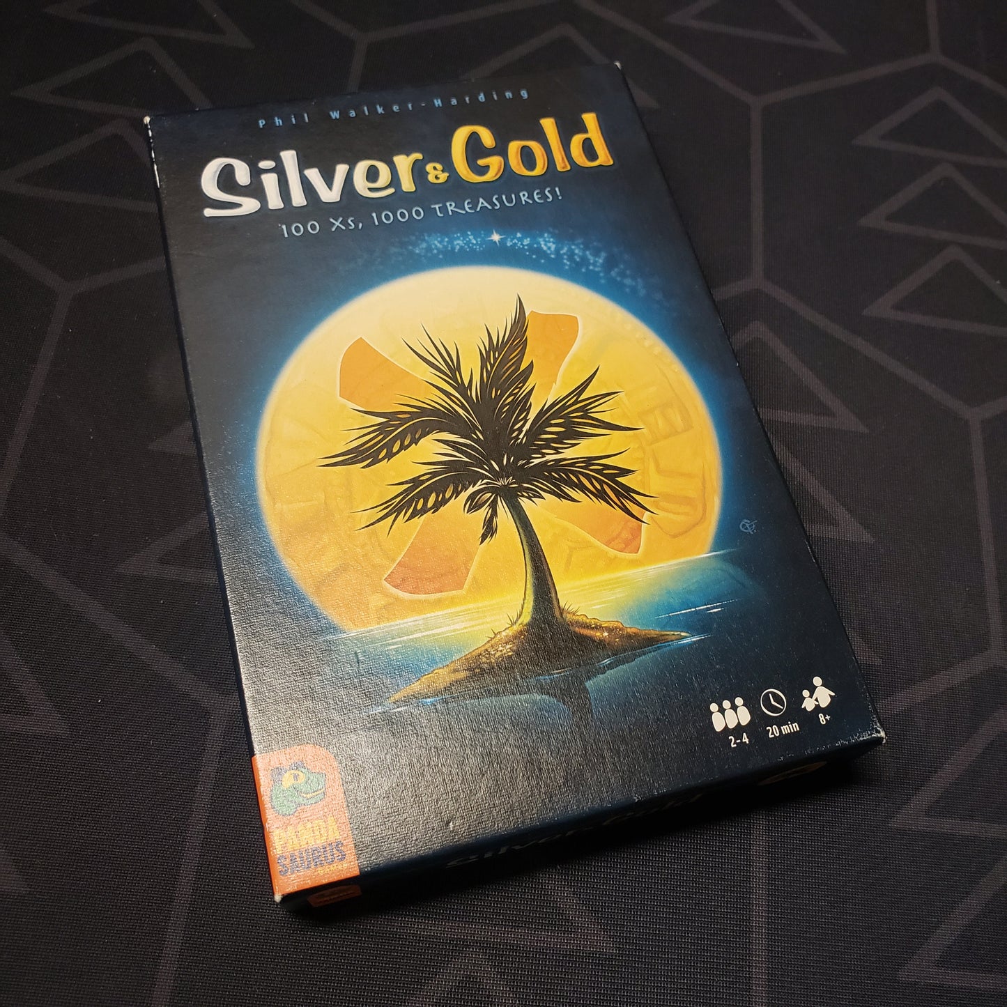 Image shows the front cover of the box of the Silver and Gold game