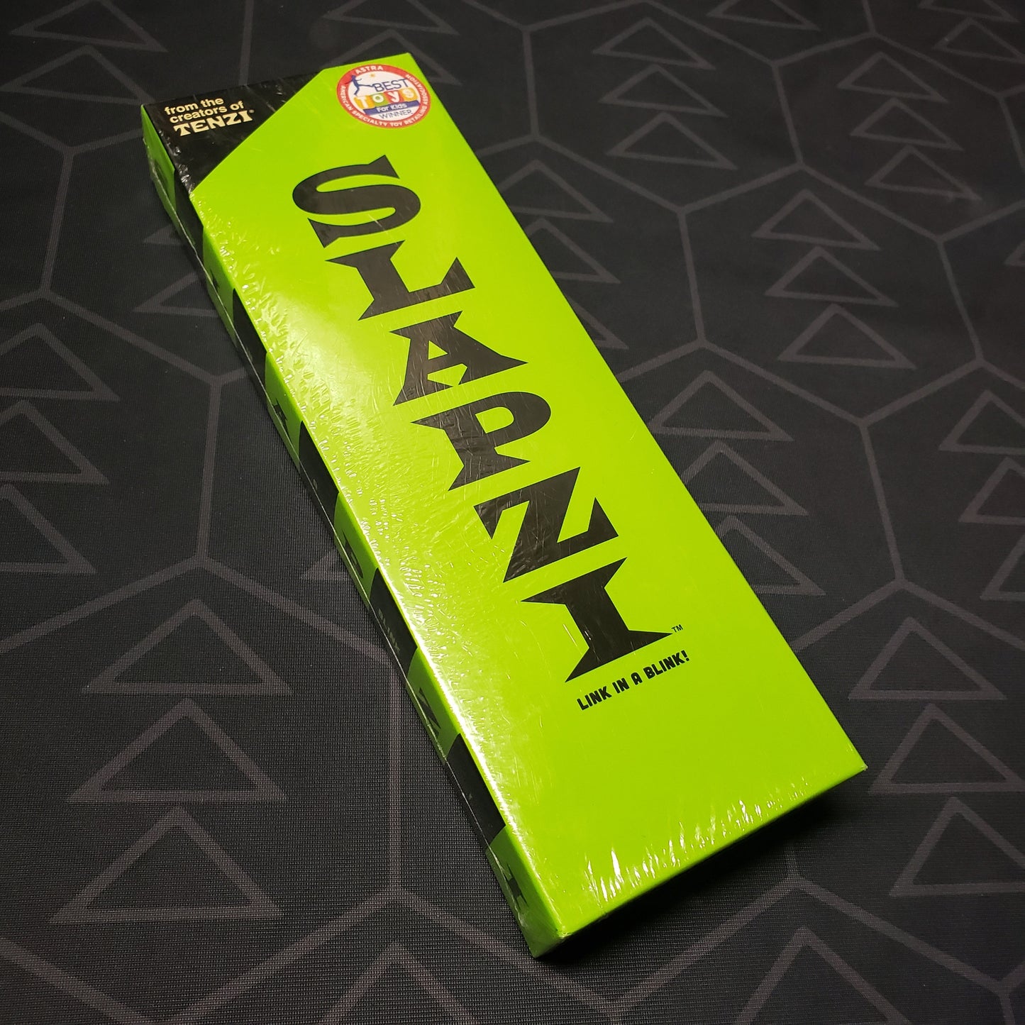 Image shows the front cover of the box for the Slapzi card game