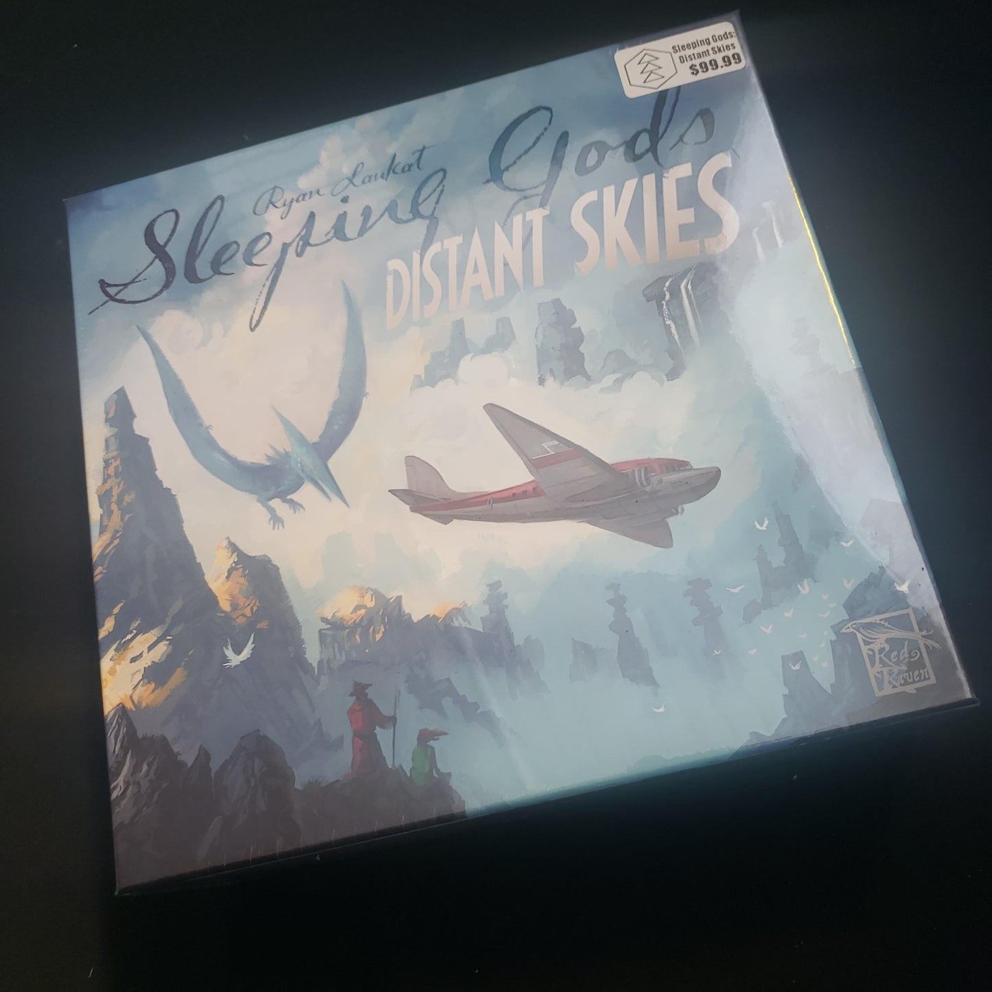 Image shows the front cover of the box of the Sleeping Gods: Distant Skies board game