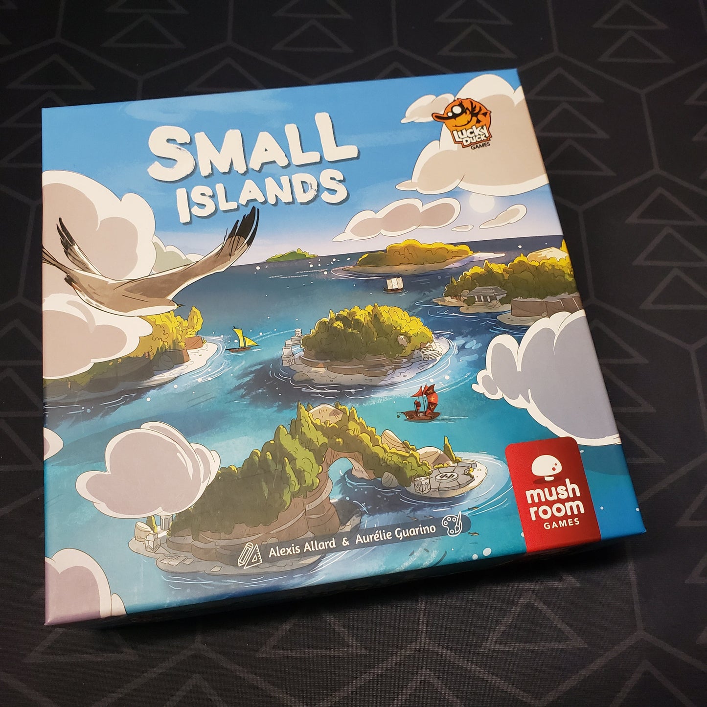 Image shows the front cover of the box for the Small Islands board game