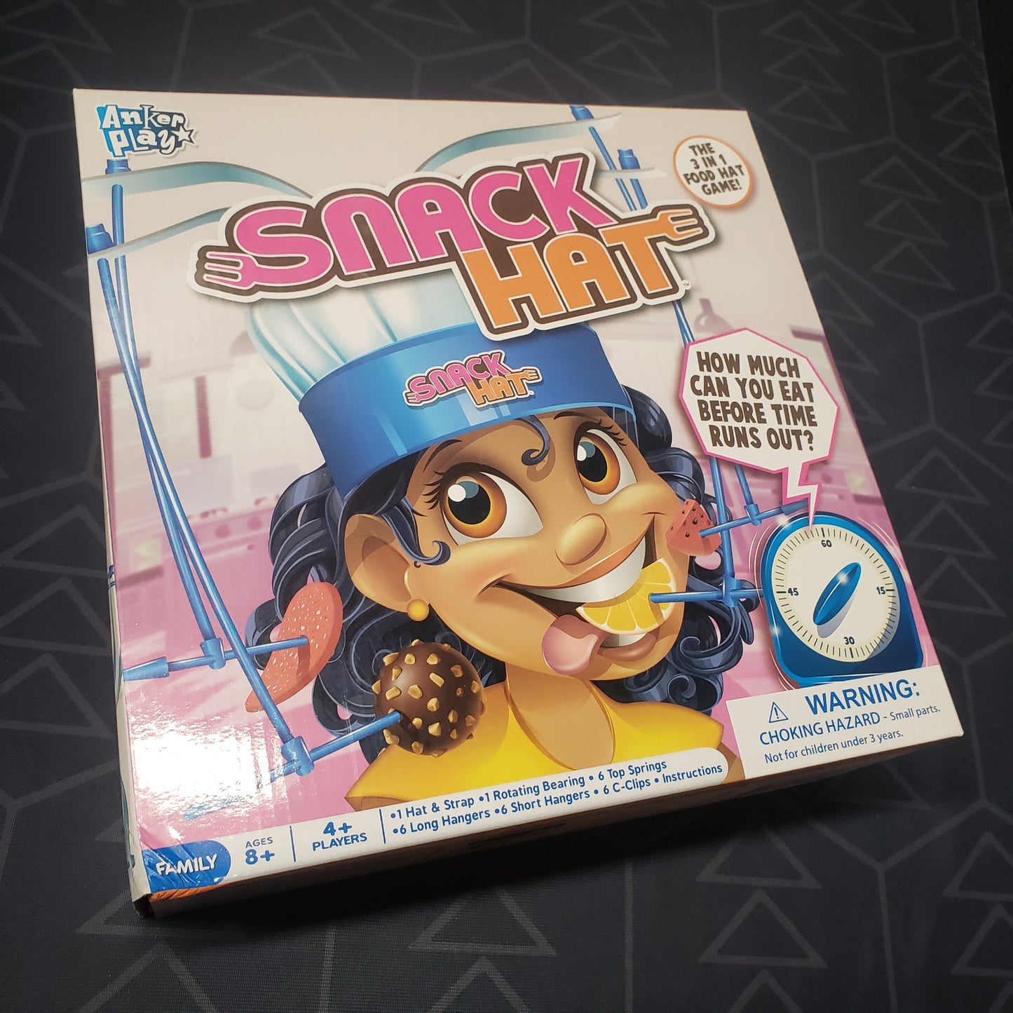Image shows the front cover of the box for the Snack Hat kids game
