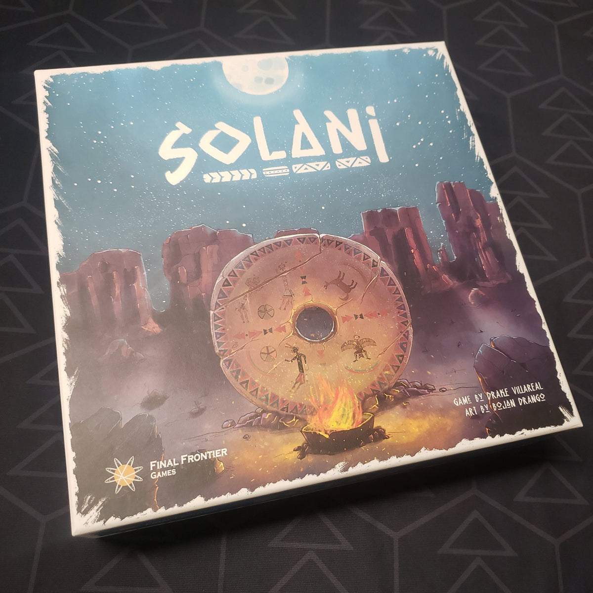 Image shows the front cover of the box for the Solani (Kickstarter Edition) board game
