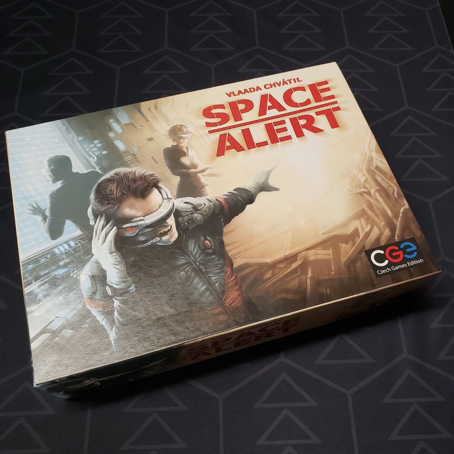 Image shows the front cover of the box of the Space Alert board game