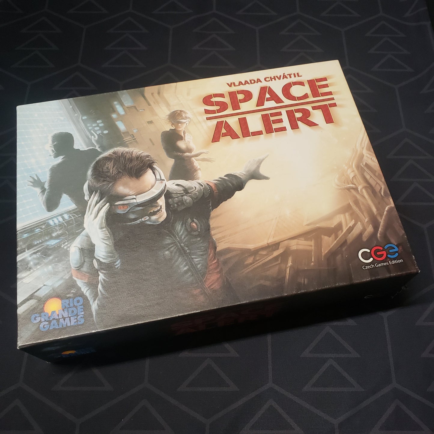 Image shows the front cover of the box of the Space Alert board game