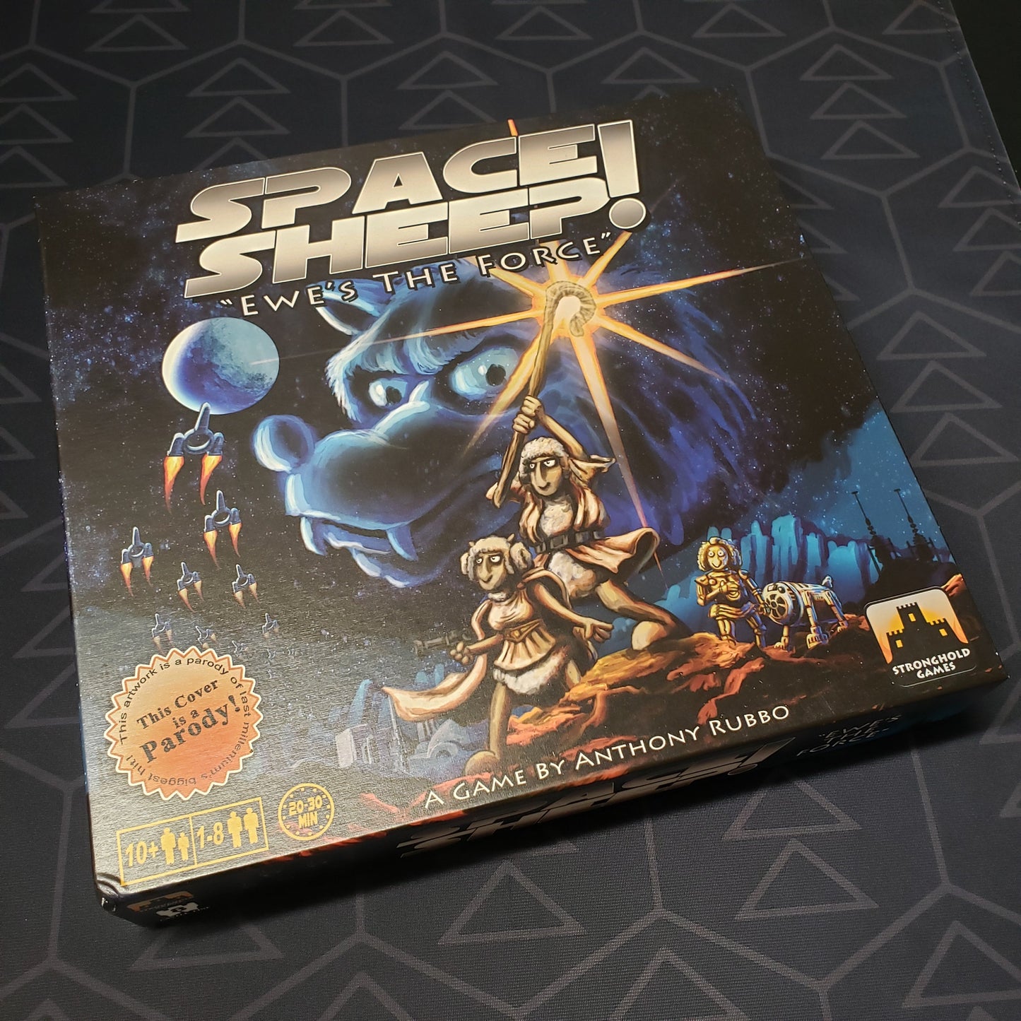 Image shows the front cover of the box of the Space Sheep board game