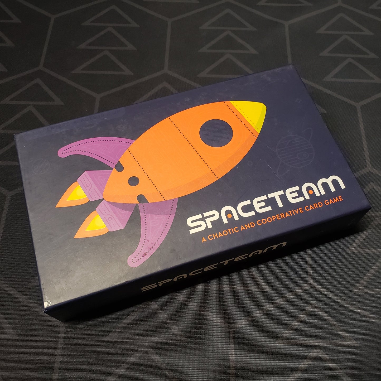 Image shows the front cover of the box of the Spaceteam card game