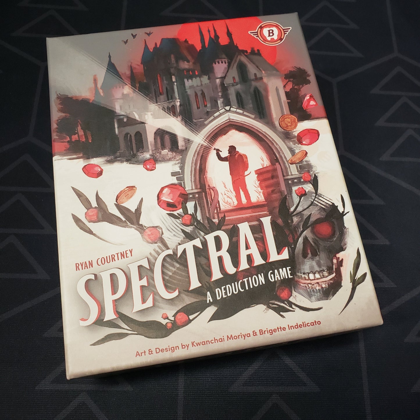 Image shows the front cover of the box for the Spectral board game