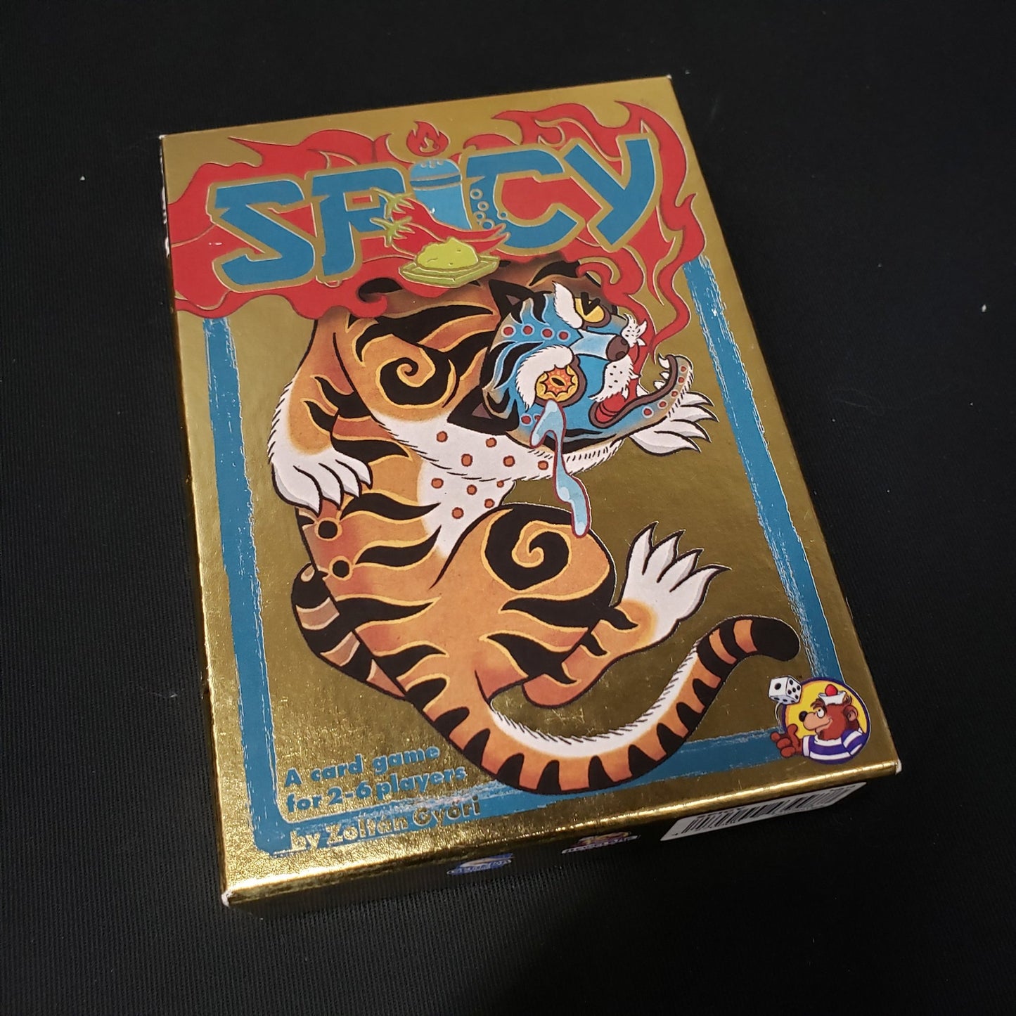 Image shows the front cover of the box of the Spicy card game